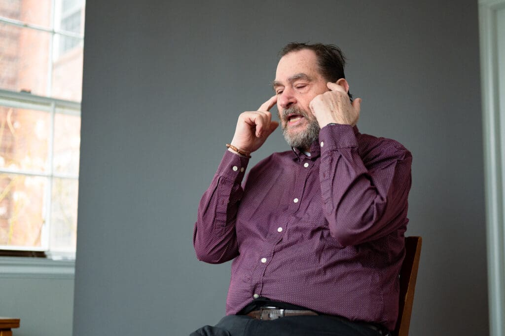 Big Talk participant during a animated storytelling pose captured in a candid portrait session.