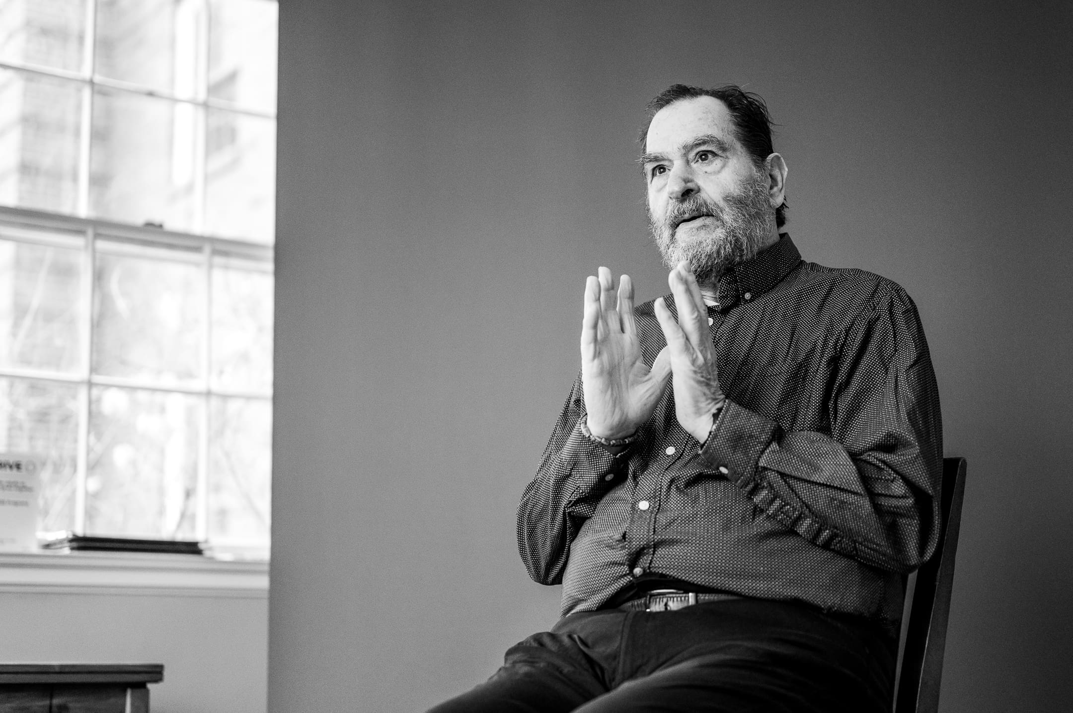 Big Talk participant during a expressive seated portrait captured in a candid portrait session.