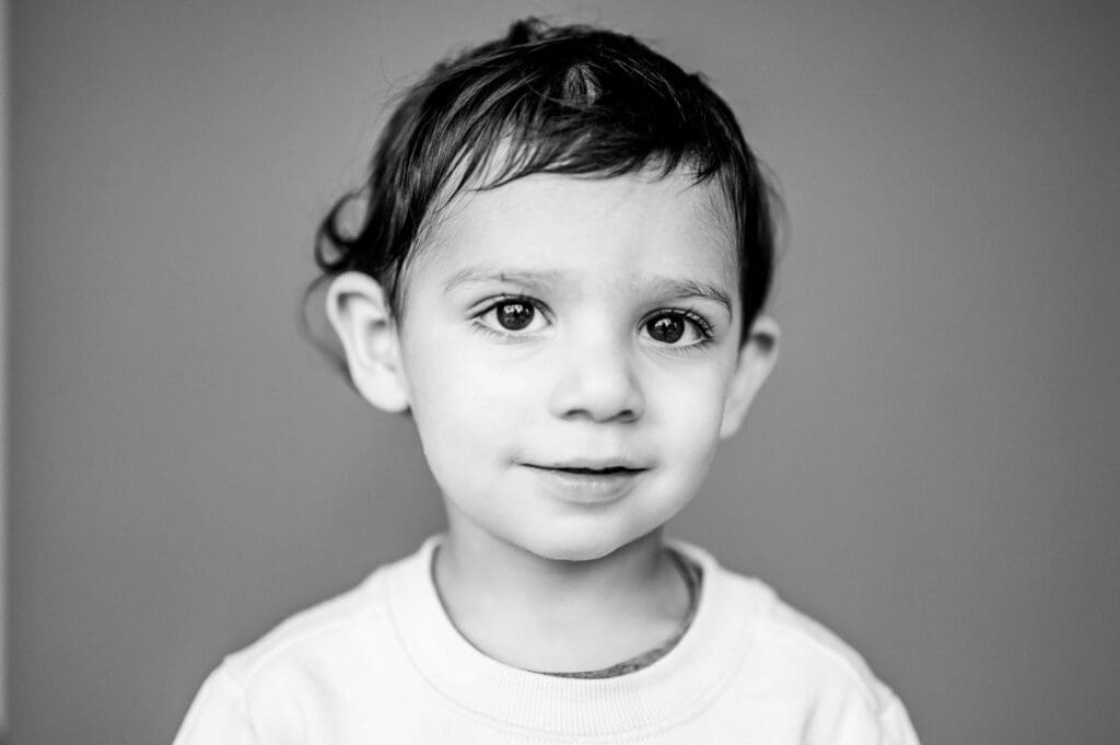 Black and white portrait of a young child with expressive eyes