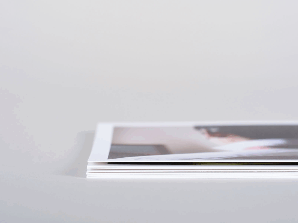 Stack of professional photo prints on archival paper for family photography
