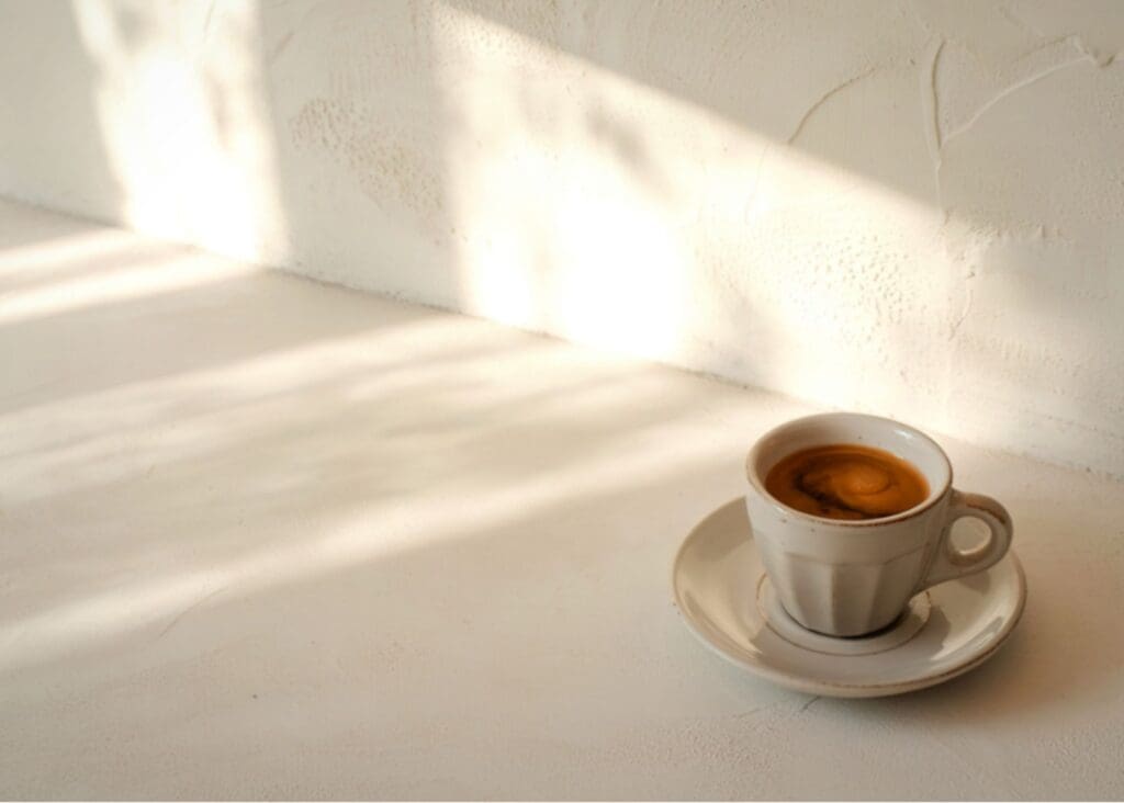 Cup of coffee in natural light representing a pause before a difficult conversation