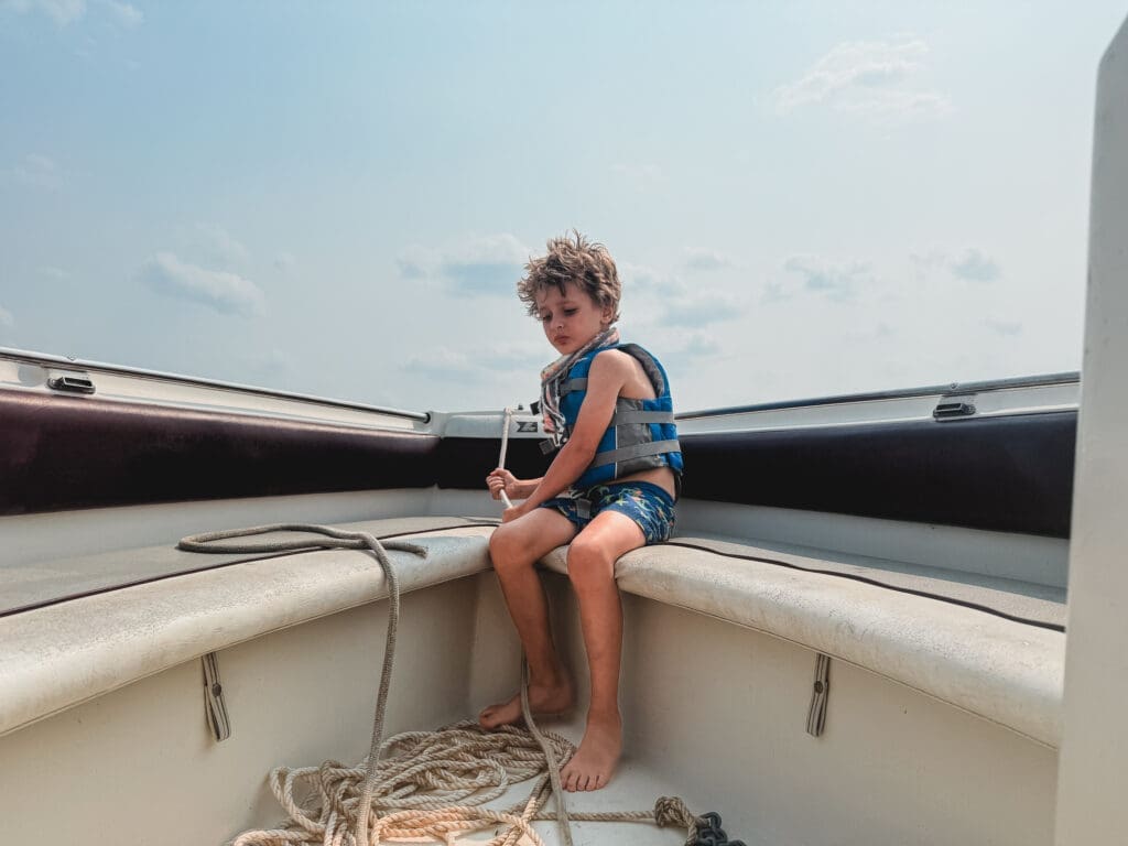 child on boat during Hudson Valley vacation family photography session