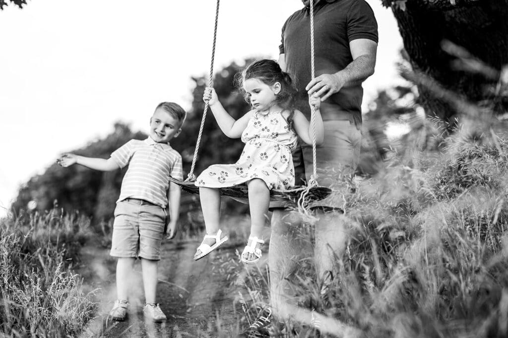 kids playing on tree swing during Hudson Valley family vacation session